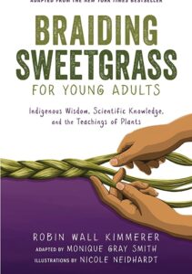 The cover of Braiding Sweetgrass has hands braiding grass