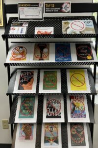 Library display showing book covers of challenged books 2023.